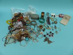 A large collection of costume jewellery to include brooches, necklaces,