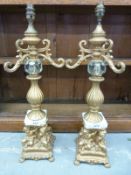 A pair of gilt metal style table lamps,