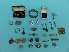 A collection of silver jewellery to include paste brooches, sweetheart brooches, bangle, seals,