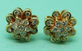 A pair of 18ct gold earrings set with diamonds, weight 4.