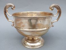 A hallmarked silver two-handled trophy or similar cup, marks rubbed, width 22cm,