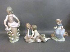 Three Lladro figurines including sweethearts,