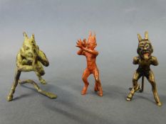 Three Austrian cold painted miniature bronze figures of the Devil, one green, length 69mm,