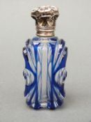 A blue overlaid glass white metal topped scent bottle, height 7.