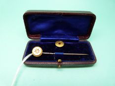 A 15ct gold stud and a 15ct gold stick pin set with a diamond in original box