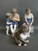 Two Bing and Grondahl figures of boys and one cat