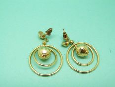 A pair of 18ct gold earrings with a faceted sphere and two hoops, 8.