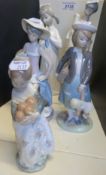 Five Lladro figurines including beach girl,
