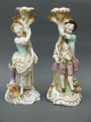 A pair of continental figural candlesticks,