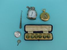 A set of cricket related buttons,