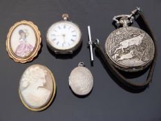 A ladies continental silver keyless winding fob watch with gilt highlighted enamel dial together