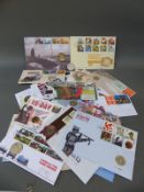 Fourteen £2 coins, commemorative stamp covers in 13 packs,