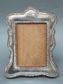 A George V hallmarked silver photograph frame to suit 5x3.