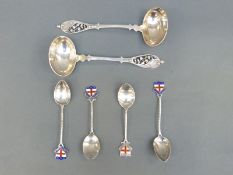 A set of four hallmarked silver enamel spoons, motto possibly relates to Mill Hill School,