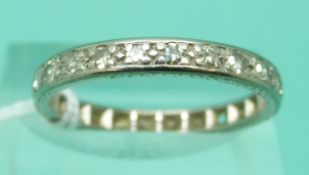 A platinum eternity ring set with diamonds (size Q)