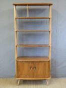 An Ercol light elm room divider with adjustable shelves above single cupboard (W85 x D40 x H191cm)