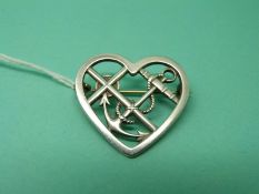 A silver brooch by Georg Jensen in the Faith,