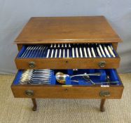 Walker & Hall twelve place setting canteen of cutlery in mahogany two drawer table