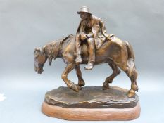H Muller bronzed figure of a man with a hat riding a horse,