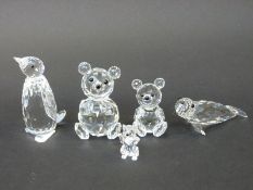 Five Swarovski cut glass animals comprising two teddy bears, a penguin,