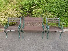 A garden bench and two matching chairs