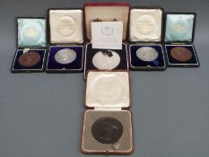 Six medallions including silver