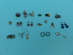 Three silver rings, silver earrings including amethyst set, sapphire earrings,