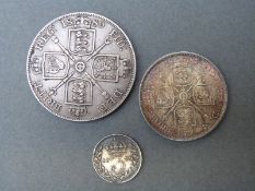 A Victoria double florin together with a florin and a threepence coin,