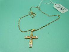 A yellow metal crucifix and bicoloured chain, both marked 750 (14.