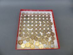 A box containing 70 £2 coins, various collectable examples including Guernsey 2006, 2012 Technology,