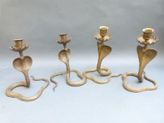 Four brass Indian figural snake candlesticks,