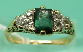An 18ct gold Victorian ring set with a baguette cut tourmaline and three diamonds to each side