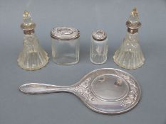A quantity of hallmarked silver-mounted dressing table items including a pair of conical bottles,