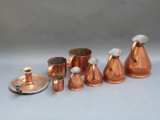 A quantity of 19thC and later copper measures,