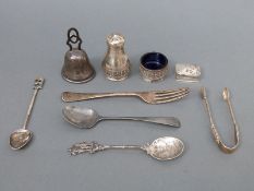 A quantity of hallmarked silver and white metal items including cutlery, hammered bell, salt,