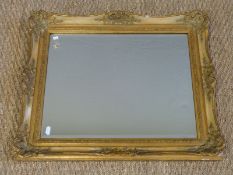A gilt framed bevelled edge mirror (54 x 64cm)