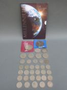 A quantity of world coinage including £5 millennium coin, some pre 1947 silver etc.