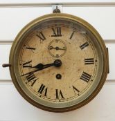 A brass cased ship's bulkhead clock with Roman dial,