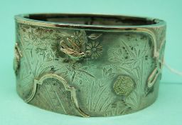 A Victorian silver Aesthetic period bangle with applied yellow metal decoration marked J.A.