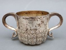 A Victorian hallmarked silver porringer with scrolling handles and embossed acanthus leaf