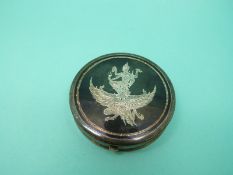 A silver Siam compact in original box