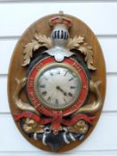 A Smiths 8 day timepiece mounted in a painted metal naval coat of arms Honi Soit Qui Mal y Pense,