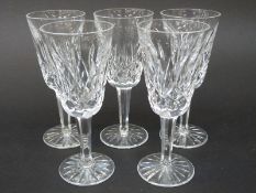 A set of five Waterford Crystal cut glass small champagne flutes,