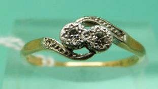 An 18ct gold ring set with diamonds in a platinum twist setting (size N), weight 2.