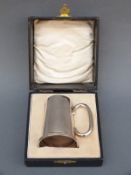 A cased George V hallmarked silver christening mug or tankard, B'ham 1928,