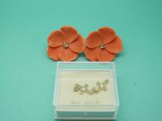 A pair of 9ct gold cross earrings and a pair of 9ct gold-backed earrings in the form of flowers