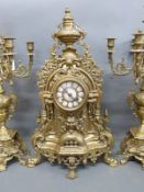A substantial ornate brass clock garniture with enamelled Roman numerals inset to dial,