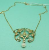 A 9ct gold Art Nouveau style necklace in a foliate design with a drop pearl