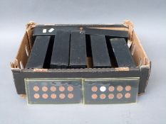 An amateur collection of early UK decimal mounted copper coins including 1/2p, 1p, and 2p examples,