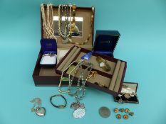 A collection of costume jewellery including two silver lockets, watches,